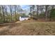 Spacious backyard with house, deck, tree surround and ample room for outdoor activities at 1504 Kimberly Pl, Canton, GA 30114
