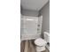 This bathroom features wood floors, a shower, and a toilet at 1504 Kimberly Pl, Canton, GA 30114