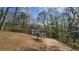 Scenic view of a two-story home with an attached garage and a long driveway at 1504 Kimberly Pl, Canton, GA 30114