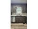 Close-up of the modern kitchen sink, counter, and cabinets with updated appliances at 1504 Kimberly Pl, Canton, GA 30114