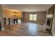 Bright living room with wood flooring, fireplace, and a view of the staircase at 1504 Kimberly Pl, Canton, GA 30114