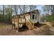 This home boasts a rear deck, neutral siding, and a bay window feature at 1504 Kimberly Pl, Canton, GA 30114