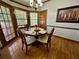 Cozy dining area with natural light, hardwood floors and a great view of the outdoors at 2514 Green Forest Ct, Snellville, GA 30078