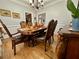 Spacious dining room features hardwood floors and elegant furniture at 2514 Green Forest Ct, Snellville, GA 30078