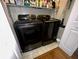The laundry closet features a modern washer and dryer for efficient cleaning at 2514 Green Forest Ct, Snellville, GA 30078