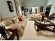 Spacious living room with carpet, couches, and natural light at 2514 Green Forest Ct, Snellville, GA 30078