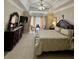 Main bedroom features carpet, a tray ceiling, and a bay window and decorative furnishings at 2514 Green Forest Ct, Snellville, GA 30078
