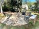 Stone patio featuring a dining area with a grill and seating, perfect for outdoor entertaining at 2514 Green Forest Ct, Snellville, GA 30078