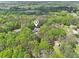 Aerial view showcases the property's secluded location amidst lush greenery and mature trees at 270 Morrow Rd, Newborn, GA 30056
