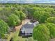 Aerial view of the home featuring well-maintained landscaping, a circular driveway, and a covered front porch at 270 Morrow Rd, Newborn, GA 30056