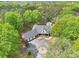 Aerial view of a stunning home surrounded by lush greenery, showcasing its expansive lot and curb appeal at 270 Morrow Rd, Newborn, GA 30056
