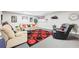 A finished basement with plush seating, an accent rug, and a warm, inviting atmosphere for relaxing and entertaining at 270 Morrow Rd, Newborn, GA 30056