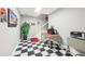 Retro basement features black-and-white tiled floor and decor at 270 Morrow Rd, Newborn, GA 30056