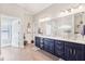 Primary bath with double vanity, granite countertop, and dark blue cabinets at 270 Morrow Rd, Newborn, GA 30056