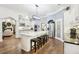 Spacious kitchen featuring a large island with seating, stainless steel appliances, and sleek white cabinetry at 270 Morrow Rd, Newborn, GA 30056
