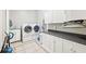 Well-equipped laundry room with modern washer/dryer, ample cabinet space, and a convenient sink at 270 Morrow Rd, Newborn, GA 30056