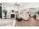 Spacious living room with a fireplace, hardwood floors, ample seating, and elegant decor at 270 Morrow Rd, Newborn, GA 30056