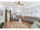 Spacious living room featuring hardwood floors, neutral walls, and comfortable seating arrangement with view to kitchen at 270 Morrow Rd, Newborn, GA 30056