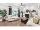 Elegant living room with hardwood floors, fireplace, and bright windows offering natural light and a relaxing atmosphere at 270 Morrow Rd, Newborn, GA 30056