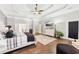 Spacious primary bedroom featuring a tray ceiling, hardwood floors, and a comfortable layout at 270 Morrow Rd, Newborn, GA 30056