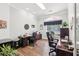 Bright office featuring hardwood floors, natural light, and two spacious work areas with ample storage space at 270 Morrow Rd, Newborn, GA 30056
