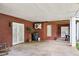 Covered patio area with brick walls, white columns, double doors, and potential for outdoor activities at 270 Morrow Rd, Newborn, GA 30056