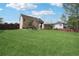 Large grassy backyard, offering ample space for outdoor activities at 3380 Duncan Bridge Dr, Buford, GA 30519