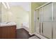 Bright bathroom with double vanity and shower with a glass enclosure and a large soaking tub at 3380 Duncan Bridge Dr, Buford, GA 30519