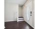 Inviting foyer featuring dark wood floors, neutral walls, and stairs leading up at 3380 Duncan Bridge Dr, Buford, GA 30519