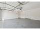 Spacious garage with epoxy flooring, ample storage, and overhead door at 3380 Duncan Bridge Dr, Buford, GA 30519