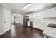 Bright, modern kitchen featuring white cabinets, stainless steel appliances, and an open layout at 3380 Duncan Bridge Dr, Buford, GA 30519