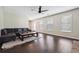 Spacious living room with hardwood floors, natural light, and a contemporary sectional sofa at 3380 Duncan Bridge Dr, Buford, GA 30519