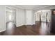 Bright and spacious living room with hardwood floors and an archway to the dining area at 3380 Duncan Bridge Dr, Buford, GA 30519