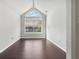 Cozy sitting room featuring a large window and wood flooring providing a tranquil space at 3380 Duncan Bridge Dr, Buford, GA 30519