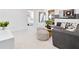 A stylish basement living room area with gray tones, comfy furniture and plenty of room to relax at 5210 Birch Valley Rd, Cumming, GA 30028