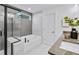 Modern bathroom with a soaking tub, walk-in shower, and granite countertops at 5210 Birch Valley Rd, Cumming, GA 30028