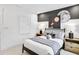 The bedroom has a unique decor with a moon-themed design and is bright from the natural light at 5210 Birch Valley Rd, Cumming, GA 30028