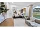 Bright bedroom featuring a gray sofa, a large window, and an inviting bed at 5210 Birch Valley Rd, Cumming, GA 30028