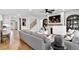 Inviting living room with hardwood floors, a fireplace, TV, comfortable seating and an open floorplan at 5210 Birch Valley Rd, Cumming, GA 30028