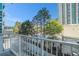 This outdoor balcony has white metal railing, views of the surrounding area, and outdoor space at 250 Pharr Ne Rd # 405, Atlanta, GA 30305