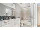 Modern bathroom featuring granite countertop, white cabinetry, and tiled shower and flooring at 250 Pharr Ne Rd # 405, Atlanta, GA 30305