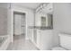 Bathroom with vanity, granite countertop, tile floors, and walk-in closet at 250 Pharr Ne Rd # 405, Atlanta, GA 30305