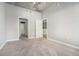 Bedroom with neutral walls and plush carpet featuring multiple doors to en suite bathroom and other rooms at 250 Pharr Ne Rd # 405, Atlanta, GA 30305