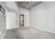 This spacious bedroom features neutral walls, plush carpet and an en suite bathroom with luxury fixtures at 250 Pharr Ne Rd # 405, Atlanta, GA 30305