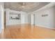 Open-concept living area with hardwood floors and kitchen view at 250 Pharr Ne Rd # 405, Atlanta, GA 30305