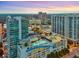 Aerial view of luxury high-rise buildings, rooftop pool, and vibrant cityscape at 250 Pharr Ne Rd, Atlanta, GA 30305