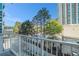 Balcony view of surrounding buildings with green foliage and trees, set against a blue sky at 250 Pharr Ne Rd, Atlanta, GA 30305
