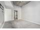 Neutral bedroom featuring grey walls, plush carpeting, and an ensuite bathroom at 250 Pharr Ne Rd, Atlanta, GA 30305