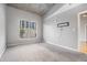 Bedroom featuring concrete ceilings and a large window with natural light at 250 Pharr Ne Rd, Atlanta, GA 30305