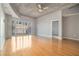 Bright living room with hardwood floors, concrete ceiling, and balcony access at 250 Pharr Ne Rd, Atlanta, GA 30305